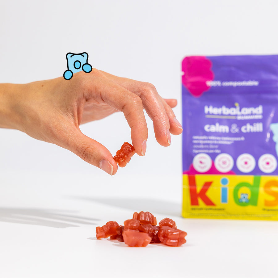 Person holding herbaland gummies, with calm and chill pouch to help relieve restlessness and nervousness for kids with strawberry flavor