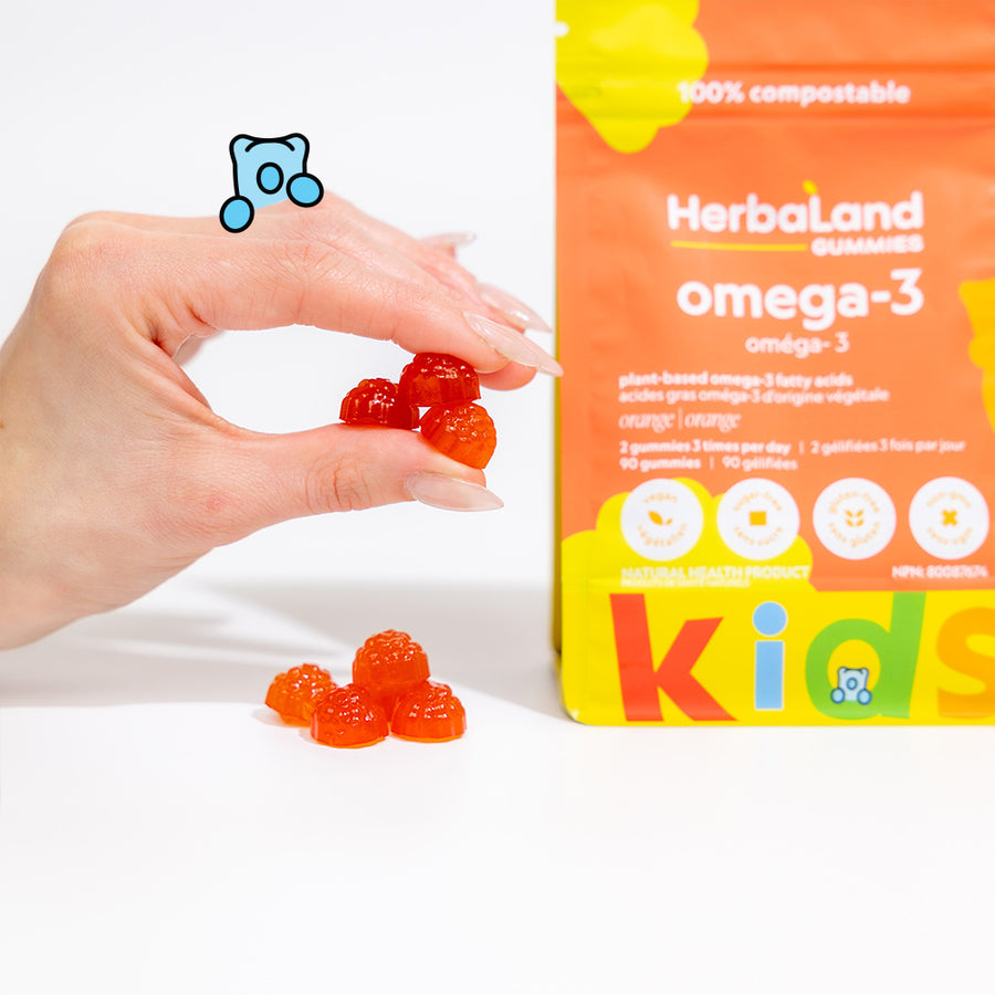 A picture of herbaland gummies with a pouch of omega 3 for kids with orange flavor